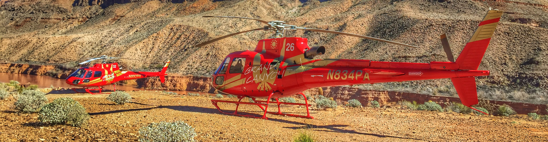 A-Star AS350 helicopters next to Colorado River